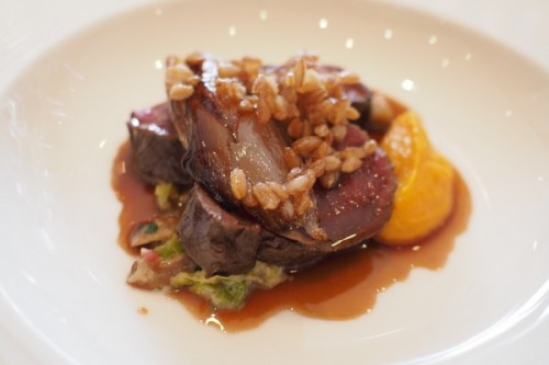 Venison loin with poached quince, soft amaretti and lemon zest