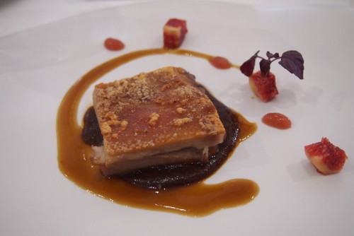 Iberian pork with mole cocoa and carrob, figs and infusion of roasted red peppers